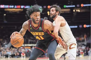  ?? Brett davis/usa Today sports ?? Atlanta Hawks forward Saddiq Bey (41) is defended by Cleveland Cavaliers guard Ricky Rubio (13) in the second half at State Farm Arena.