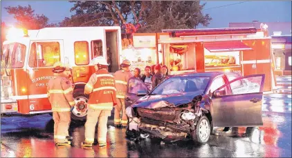  ?? KEITH GOSSE/THE TELEGRAM ?? This collision sent two people to hospital and left one car straddling a traffic island at the intersecti­on of Elizabeth Avenue and Torbay Road.