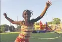  ??  ?? Zakila Simmons, 6, plays in front of the bouncy castle during Friday’s event at the community center in Frayser.