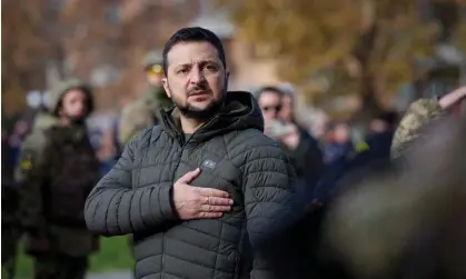  ?? Photograph: Ukrainian Presidenti­al Press Service/Reuters ?? The Ukrainian president, Volodymyr Zelenskiy, sings the national anthem during a visit to Kherson this week.