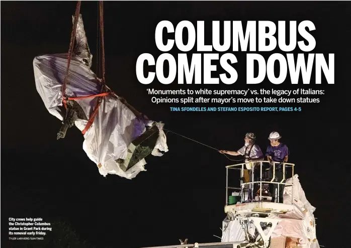  ?? TYLER LARIVIERE/SUN-TIMES ?? City crews help guide the Christophe­r Columbus statue in Grant Park during its removal early Friday.