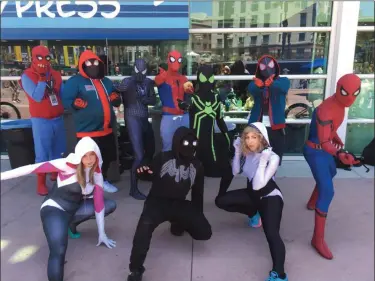  ?? PHOTOS BY MARK PODOLSKI — THE NEWS-HERALD ?? Spider-Man cosplayers show off outside San Diego Comic-Con on July 20.
