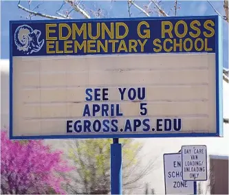  ??  ?? A sign welcomes students back to Edmund G. Ross Elementary School, 6700 Palomas NE.