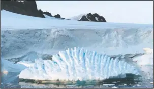  ?? The Associated Press ?? UNUSUAL ICEBERG: This January 2018 photo provided by researcher Andrew Shepherd shows an unusual iceberg near the Rothera Research Station on the Antarctic Peninsula. In a study released Wednesday, an internatio­nal team of ice experts said the melting...