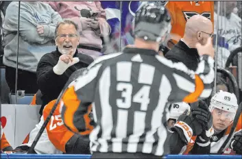  ?? Chris O’meara The Associated Press ?? Philadelph­ia Flyers coach John Tortorella yells at referee Brad Meier after being kicked out a game against the Tampa Bay Lightning on March 9.