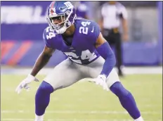  ?? Julio Cortez / Associated Press ?? Giants cornerback Eli Apple waits for the snap in an Aug. 11 game in East Rutherford, N.J.