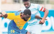  ?? FILE ?? Alburn Facey (right), then of Reno, in a tussle with McKaully Tulloch of Harbour View during a FLOW Cup match in 2014.