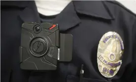  ?? ?? The LAPD adopted the widespread use of body cameras amid pressure from activists protesting the police killings of multiple unarmed Black people across the US. Photograph: Damian Dovarganes/AP