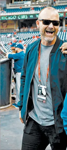  ??  ?? Former catcher David Ross, visiting with Joe Maddon before a Cubs game in 2017, succeeded his