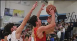  ?? RICK SILVA – RED BLUFF DAILY NEWS ?? Chico’s Odin Nielsen, right, drives to the basket past Pleasant Valley’s Hayden Rick in the Panthers game against the Vikings on Friday at Pleasant Valley High School.