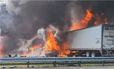  ?? Picture: AP ?? Flames engulf vehicles after a fiery crash in Florida. At least seven people were killed