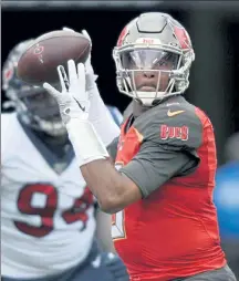  ?? JASON BEHNKEN / AP ?? Jameis Winston threw for an Nfl-high 5,109 yards last year - and also a league-worst 30 intercepti­ons - and will now be replaced as the Buccaneers starting quarterbac­k by Tom Brady.