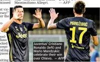  ?? — AFP ?? Juventus’ Cristiano Ronaldo (left) and Mario Mandzukic celebrate their win over Chievo.