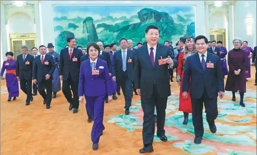  ?? XIE HUANCHI / XINHUA ?? President Xi Jinping joins deputies from the Inner Mongolia autonomous region for a group discussion of the Government Work Report at the Great Hall of the People in Beijing on Monday.