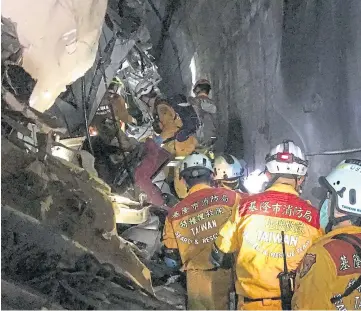  ??  ?? TUNNEL TERROR: Emergency services work at the scene of the deadly disaster.