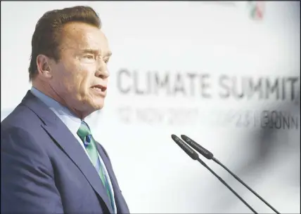  ?? AP PHOTO ?? Former governor of California Arnold Schwarzene­gger talks in the “Bonn-Zone” during the World Climate Conference in Bonn, Germany. During the summit, cities and regions emphasize that climate protection is not only an issue for national government­s.