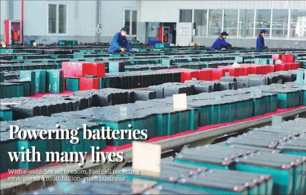  ?? WANG BIAO / FOR CHINA DAILY ?? Staff of Tianneng Group work on a production line at an industrial park in Jieshou, Anhui province. The company makes recycled fuel batteries for electric vehicles.