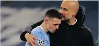  ?? REUTERS/Phil Noble ?? MANCHESTER City manager Pep Guardiola with one of his in-form players Phil Foden.