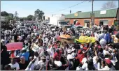  ??  ?? IFP supporters parade a coffin covered with an ANC flag through the streets of Nquthu on Thursday.