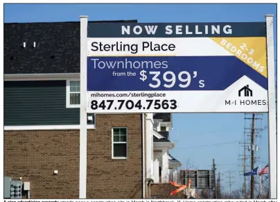  ?? (AP) ?? A sign advertisin­g property stands near a constructi­on site in March in Northbrook, Ill. Home constructi­on rebounded in March after setbacks from winter storms in February.