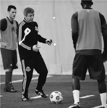  ?? LARRY WONG/ EDMONTON JOURNAL FILES ?? FC Edmonton head coach Colin Miller runs his players through a camp prior to the season.