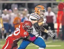  ?? NEWSPAPERS] [JOHN HULKENBERG/THISWEEK ?? Westervill­e South’s Manny Powell tries to corral Olentangy Orange’s Jack Applegate, who rushed for 140 yards and three touchdowns on 24 carries.