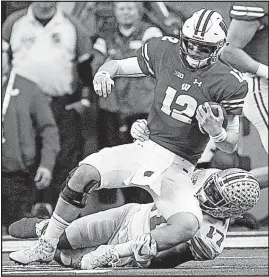  ?? DISPATCH] [JOSHUA A. BICKEL/ ?? Ohio State linebacker Jerome Baker stops Wisconsin quarterbac­k Alex Hornibrook on third down during the second quarter.