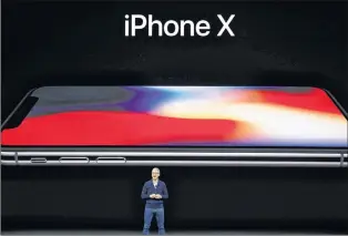  ?? AP PHOTO ?? Apple CEO Tim Cook announces the new iphone X at the Steve Jobs Theater on the new Apple campus, Tuesday, Sept. 12, 2017, in Cupertino, Calif.