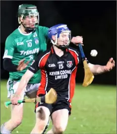  ??  ?? Billy Dunne, Oulart-The Ballagh’s chief marksman, under pressure from Liam Flood of Cloughbawn.