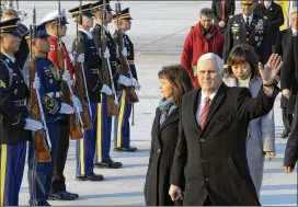  ?? KIM MIN-HEE / GETTY IMAGES ?? Vice President Mike Pence and his wife, Karen, arrive Thursday at Osan Air Base in Pyeongtaek, South Korea. He is visiting to lead the U.S. delegation in today’s opening ceremony of the Pyeongchan­g Winter Olympics.