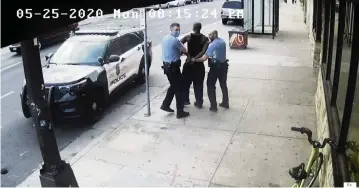  ?? Court TV via AP ?? Video shows Officers Thomas Lane, left, and J. Alexander Kueng escorting George Floyd to a police car.