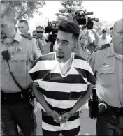  ?? ASSOCIATED PRESS ?? IN THIS AUG. 22 FILE PHOTO, Cristhian Bahena Rivera is escorted into the Poweshiek County Courthouse for his initial court appearance in Montezuma, Iowa.