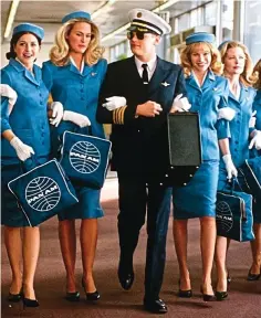  ??  ?? Outdated: Leonardo DiCaprio in a pilot’s uniform with a group of air hostesses in the film Catch Me If You Can