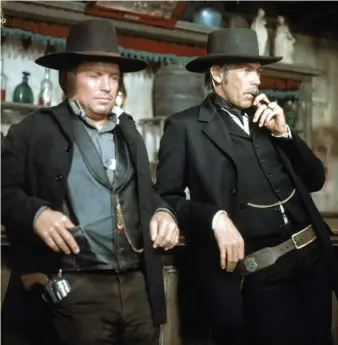  ?? Photos Getty Images ?? Richard Jaeckel, left, and James Coburn star in Pat Garrett and Billy the Kid