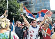  ?? ?? All change: Novak Djokovic during a practice session for the Australian Open; a protester outside his hotel; fans react to a Jan 10 ruling that he could stay in the country; Alex Hawke, immigratio­n minister, who cancelled the visa