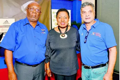  ?? IAN ALLEN/PHOTOGRAPH­ER ?? Sports Minister Olivia Grange (centre) shares the spotlight with Cubie Seegobin (right), track and field manager and Adidas affiliate, and Glen Mills head coach at Racers Track Club and chairman of the Racers Adidas Grand Prix Organising Committee, during the media launch of the event at The Jamaica Pegasus hotel in Kingston yesterday.