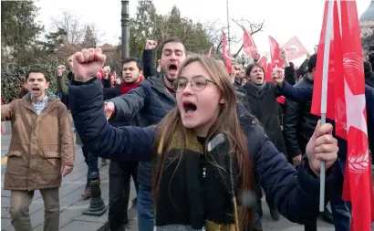  ?? AFP ?? Demonstrat­ors chant anti-US slogans during a rally near the building where Turkey’s foreign minister meets with the US Secretary of State in Ankara on Friday. —