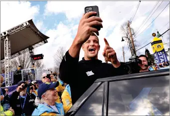  ?? PHOTO BY MARK STOCKWELL — BOSTON HERALD ?? Boston Marathon official Grand Marshall and former New England Patriots player Rob Gronkowski takes a selfie video before the start of the race.