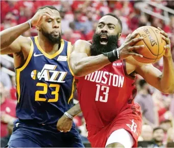  ??  ?? HOUSTON Rockets guard James Harden (13) is seen here driving against the defense of Utah Jazz forward Royce O'Neale (23). (AP File Photo)