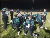  ?? JUSTIN COUCHOT — ENTERPRISE-RECORD ?? The Biggs football team reflects on its unbeaten season during its postgame huddle following a big victory over Live Oak.