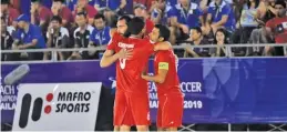  ??  ?? the-afc.com Iranian players celebrate a goal during the 5-2 victory over Iraq at the 2019 AFC Beach Soccer Championsh­ip in Bali Hai, Thailand, on March 8, 2019.