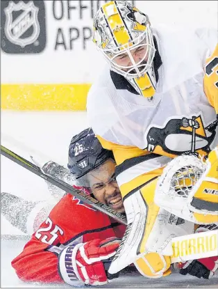  ?? AP PHOTO ?? Washington Capitals’ Devante Smith-pelly collides into Pittsburgh Penguins goaltender Matt Murray during NHL playoff action Sunday in Washington.