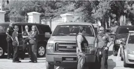  ?? EMILY MICHOT emichot@miamiheral­d.com ?? Police gather outside the Aventura condo at 18151 NE 31st Ct. where 56-year-old, bombing suspect Cesar Sayoc was once reported to live.