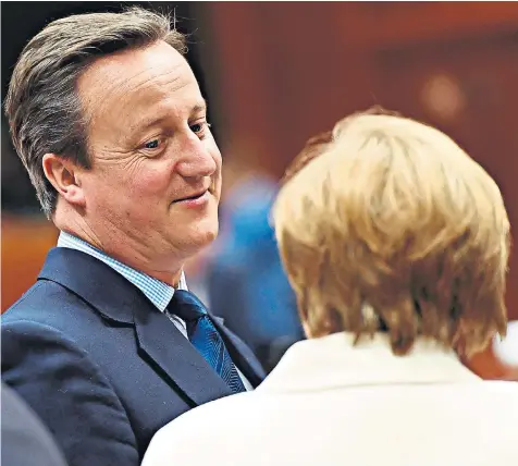  ??  ?? David Cameron with Angela Merkel in Brussels yesterday. He has told the German chancellor he lost the Brexit vote because of immigratio­n fears