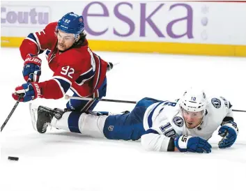  ?? PHOTO AGENCE QMI, JOËL LEMAY ?? Jonathan Drouin a tenté d’empêcher J.T.Miller de lui soutirer la rondelle.