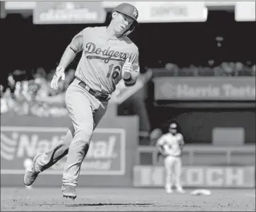  ?? Erik Lesser EPA/Shuttersto­ck ?? WILL SMITH CIRCLES the bases after getting the Dodgers’ offense started with a solo home run in the third inning. He also had a sacrifice fly and two doubles in his first game since being called up from triple A.