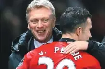  ?? PHIL NOBLE / REUTERS ?? Manchester United manager David Moyes celebrates with Robin van Persie after their English Premier League match against Arsenal at Old Trafford on Sunday. United won 1-0 thanks to a van Persie header in the 27th minute.