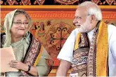  ??  ?? Narendra Modi with Bangladesh PM Sheikh Hasina. The PM is expected to reach the neighbouri­ng country on March 26. File photo