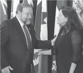  ?? ANDREW VAUGHAN / THE CANADIAN PRESS FILES ?? N.B Justice Minister Denis Landry with federal Justice Minister Jody Wilson-Raybould.