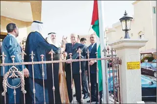  ?? Photo by Ahmed Al-nakeeb ?? The Palestinia­n flag being raised at the Palestinia­n embassy by President Mahmoud Abbas.